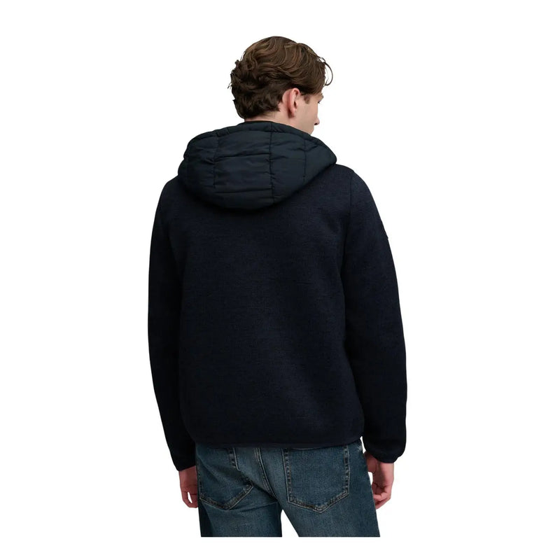 Superdry Veste à capuche en maille hybride pour homme, noire, matelassée, avec détails de surpiqûres discrets (vue de face).