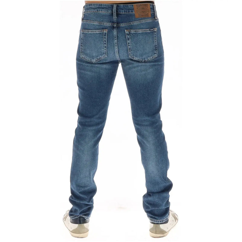 Superdry Jean homme en denim bleu délavé, poches arrière et empiècement en cuir marron, vue arrière