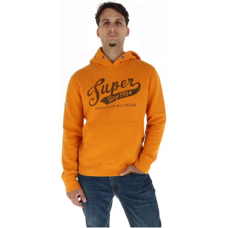 Superdry Sweat à capuche homme en molleton de coton vert, orné d'un logo Superdry orange et de l'inscription « Qualité dans tous les domaines » sur la poitrine.