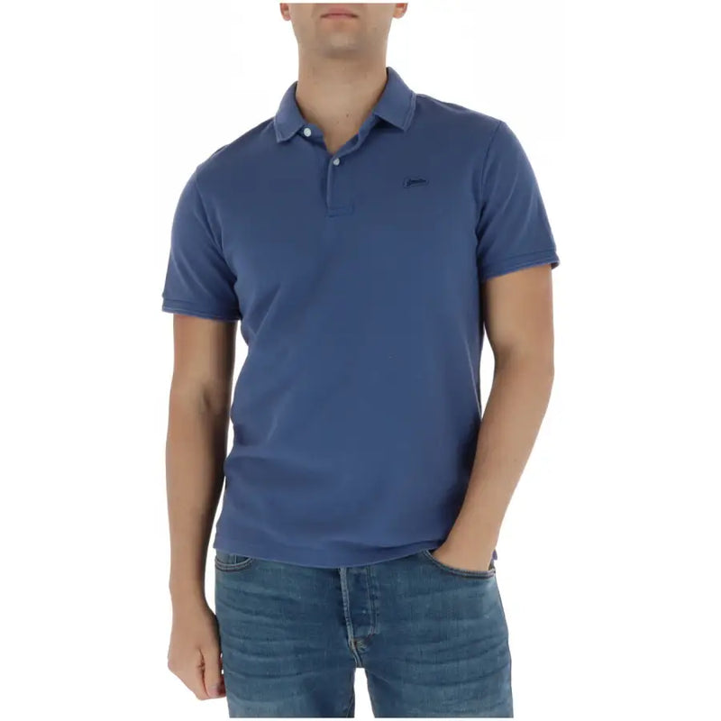 Polo bleu à manches courtes en coton de Superdry homme avec logo brodé discret sur la poitrine gauche M1110452A