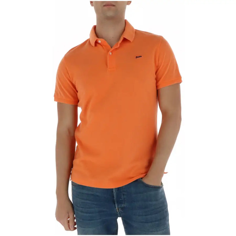 Superdry Polo homme bleu à manches courtes en coton orné d'un tissu orange vif et d'un petit logo noir sur la poitrine