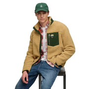 Superdry Sweat-shirt polaire jaune à fermeture éclair intégrale pour homme, doté d'une veste en peau lainée beige avec des accents verts et une poche avant zippée.