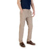 Men’s tan casual pants and brown boat shoes displayed together