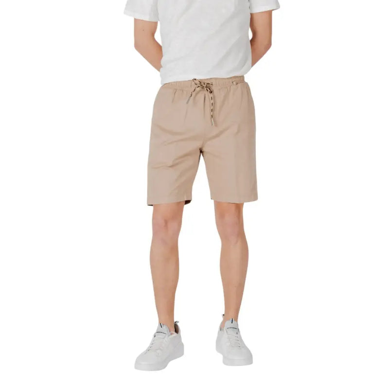 Tan drawstring shorts made of beige cotton with a drawstring waistband and subtle side pockets for casual wear