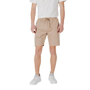 Tan drawstring shorts made of beige cotton featuring a waistband with drawstring and side pockets