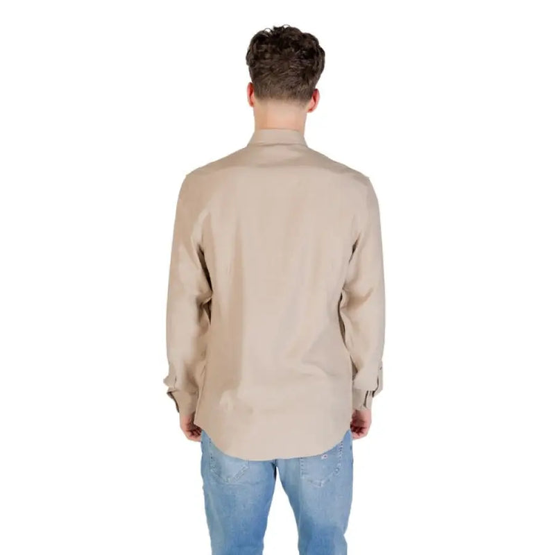 Beige and Tan Long Sleeve Shirt displayed with Blue Jeans in a fashion product image