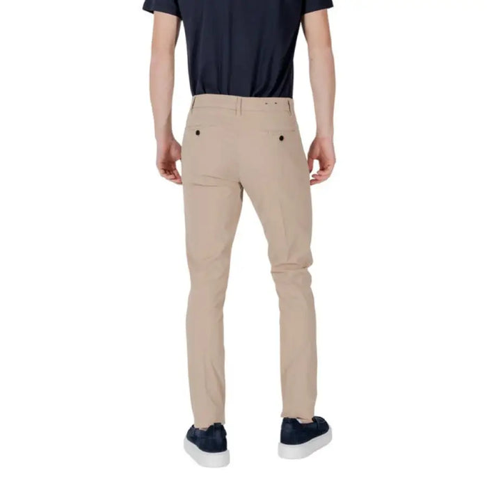Tan slim-fit trousers for men displayed in a product image