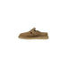 Tan suede clog with buckle detailing displayed in the product image
