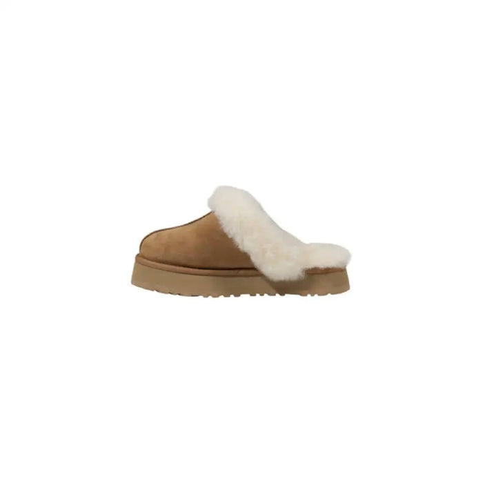 Tan suede UGG slipper with white fur trim displayed in the product image