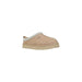 Tan UGG Slipper displayed with soft suede exterior and cozy shearling lining
