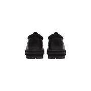 Timberland Chaussures à lacets en cuir noir pour hommes, avec semelle épaisse et col rembourré pour une tenue décontractée et résistante.