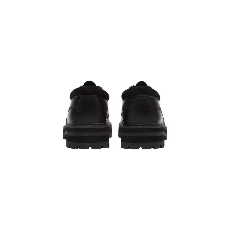 Timberland Chaussures à lacets en cuir noir pour hommes, avec semelle épaisse et col rembourré pour une tenue décontractée et résistante.