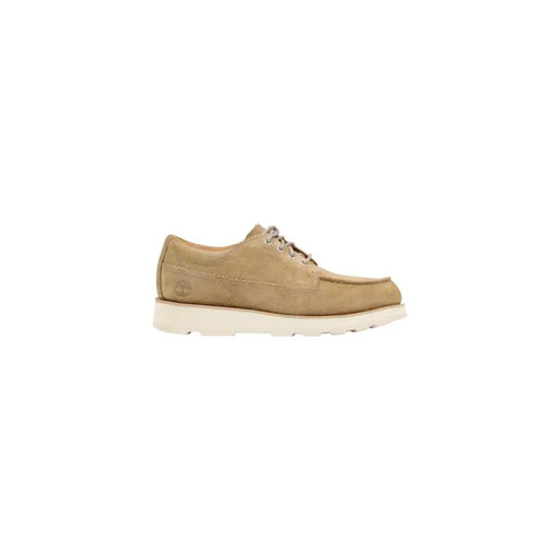 Timberland Chaussures à lacets pour homme en daim beige clair avec semelle en caoutchouc blanc et lacets gris, idéales pour le printemps et l'été.
