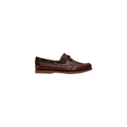 Timberland Mocassins en cuir marron pour homme, avec surpiqûres beiges et semelle en caoutchouc, modèle bateau.