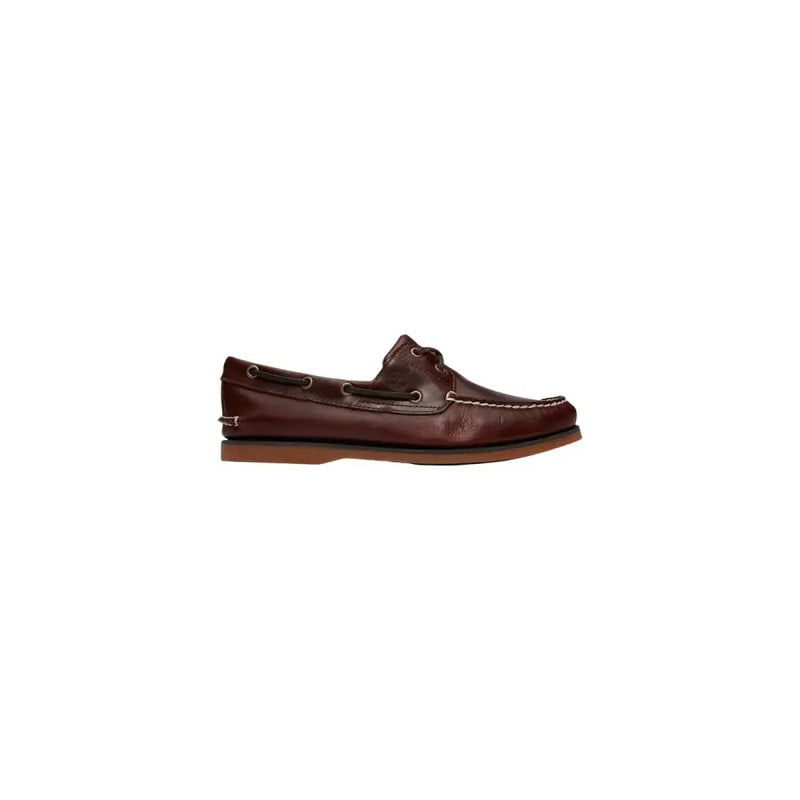 Timberland Mocassins en cuir marron pour homme, avec surpiqûres beiges et semelle en caoutchouc, modèle bateau.