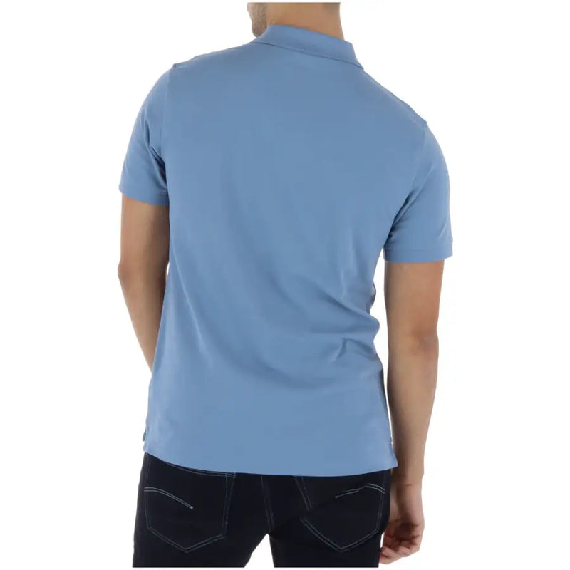 Timberland Polo homme bleu clair à manches courtes en coton et élasthanne, col classique et coutures soignées.