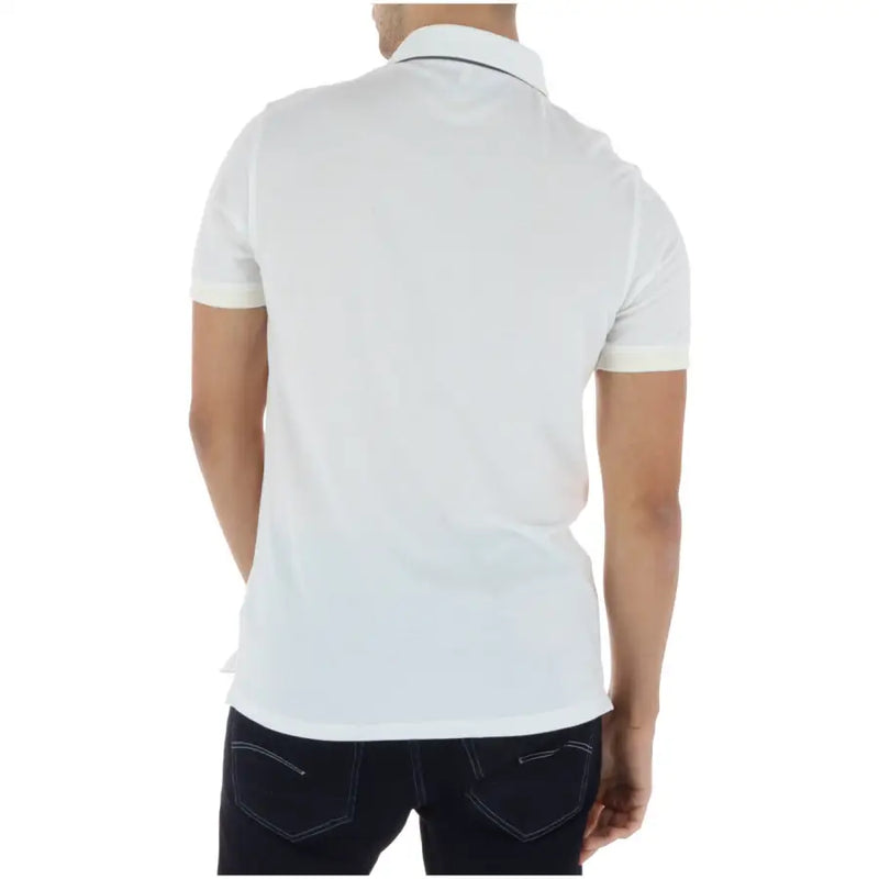 Timberland Polo blanc à manches courtes pour homme, 100 % coton, avec de discrètes finitions bleu marine au col et aux poignets.