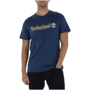 bleu marine Timberland hommes t-shirt avec un logo doré et un emblème d'arbre sur la poitrine en matière de coton