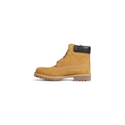 Timberland Bottes pour homme en cuir marron, modèle slip-on, tige beige de 15 cm, col de talon en caoutchouc noir et œillets dorés.