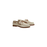 Timberland women leather moccasin shoes in beige with cream leather, brown laces, and matching rubber sole