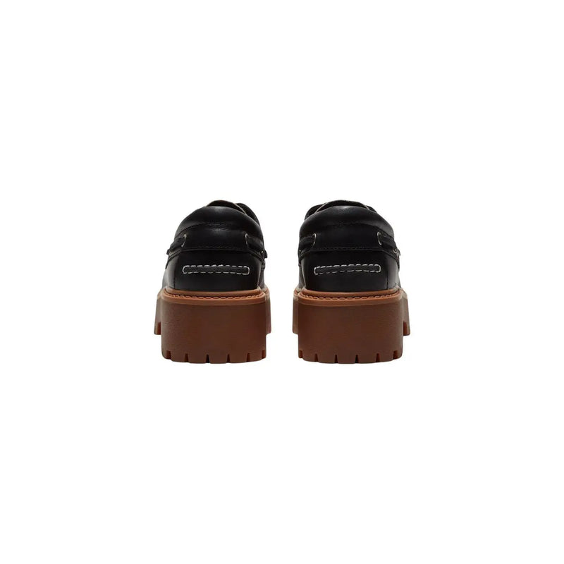 Timberland women leather platform shoes in black featuring black leather loafers with chunky brown rubber soles and white stitching