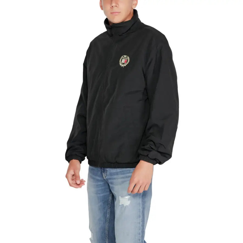 Black Tommy Hilfiger windbreaker jacket with embroidered crest on left chest for fall winter men