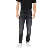 Black slim fit jeans with distressed details and white stitching.