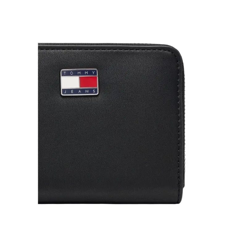 Tommy Hilfiger black zip wallet for women with textured surface and logo patch