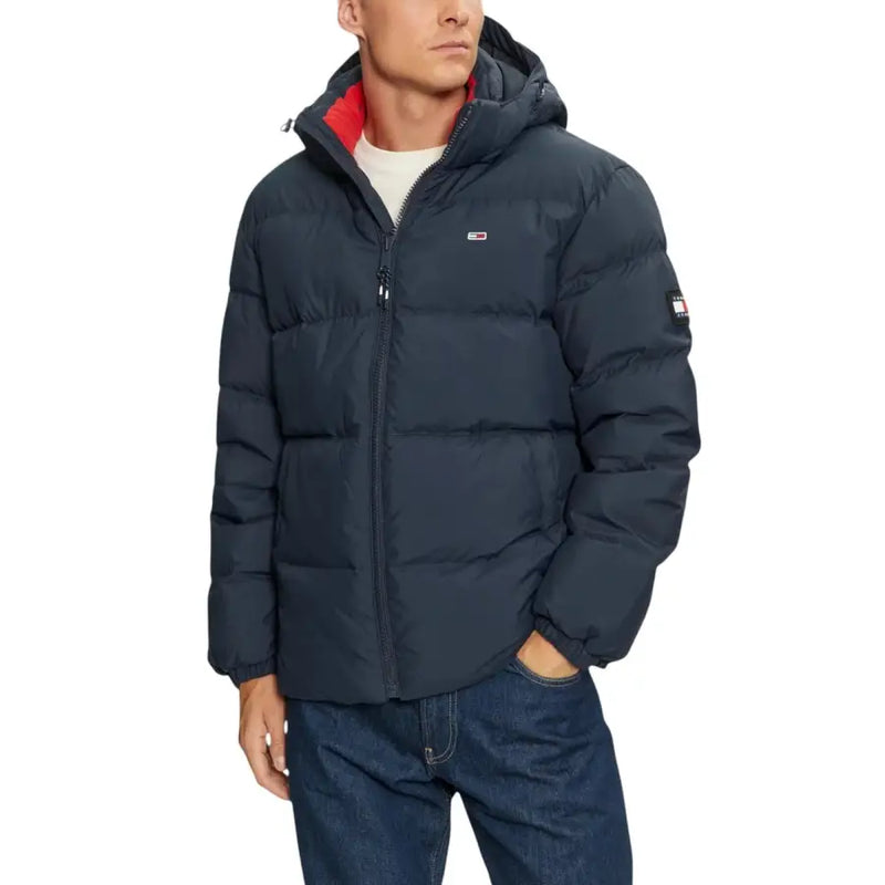 Tommy Hilfiger blue nylon hooded jacket for men with dark navy puffer style and red-lined hood featuring logo patch