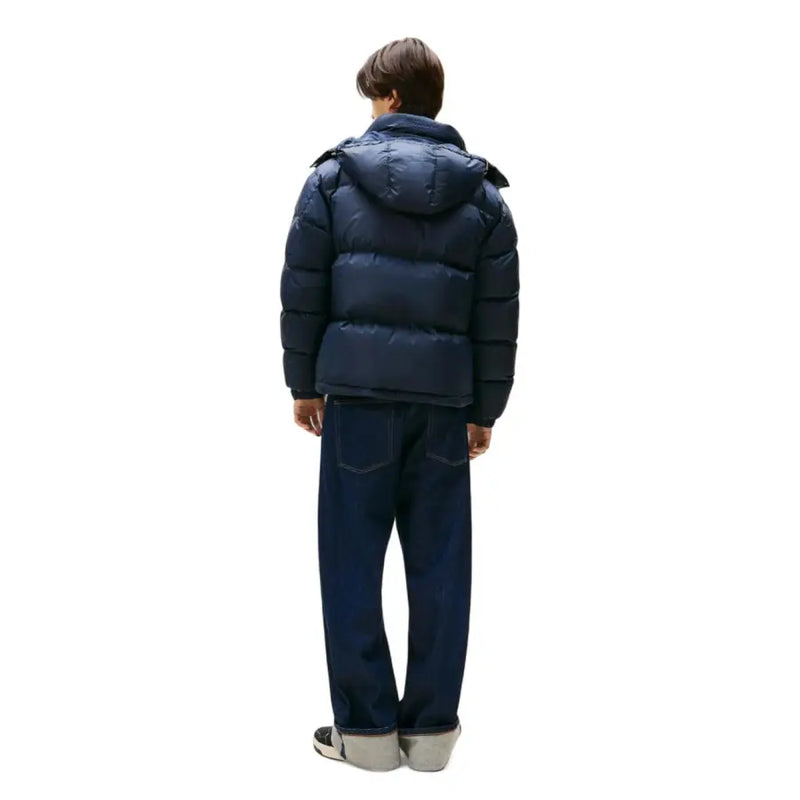 Navy blue puffer jacket with hood and quilted design, popular brand lacoste.