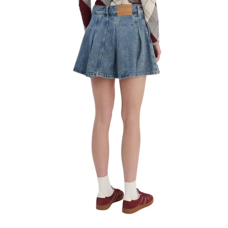 Blue organic cotton denim pleated mini skirt for women by Tommy Hilfiger with brown leather brand patch at waistband