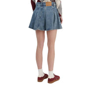 Tommy Hilfiger Mini-jupe plissée en denim de coton biologique bleu avec empiècement en cuir marron