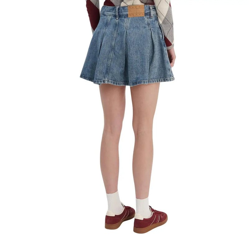 Blue organic cotton denim pleated mini skirt for women by Tommy Hilfiger with brown leather brand patch at waistband