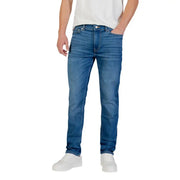 Blue denim jeans with a slim fit and white sneakers.