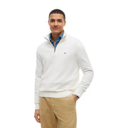Tommy Hilfiger Pull en cachemire blanc à col zippé pour homme, avec logo discret sur la poitrine (vue de face).