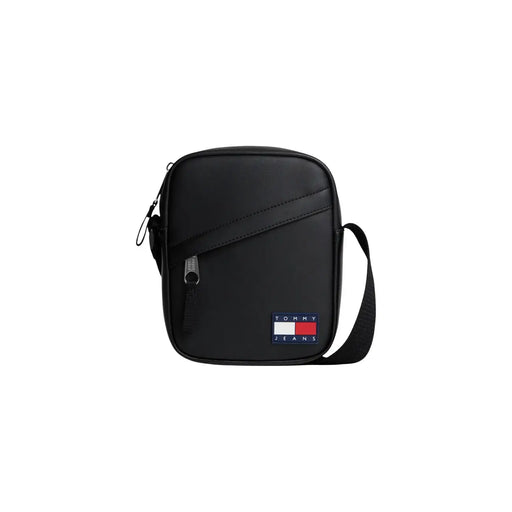 Tommy Hilfiger Sac bandoulière noir pour femme, style minimaliste, orné d'un écusson drapeau (vue de face).