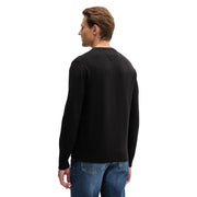 Pull noir à manches longues et col rond, en maille lisse, confectionné en coton biologique par Tommy Hilfiger Jeans hommes