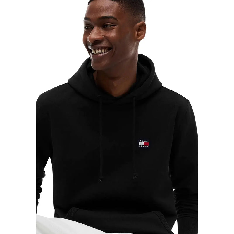 Tommy Hilfiger Jeans Sweat à capuche noir en coton biologique pour homme, avec un petit logo brodé sur la poitrine.