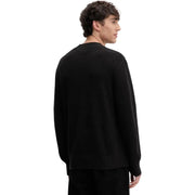Pull noir à col rond en maille côtelée et manches longues, en coton biologique de Tommy Hilfiger Jeans hommes