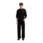 Tommy Hilfiger Jean homme, pull noir en maille côtelée de coton biologique avec petit logo rouge et blanc sur la poitrine gauche