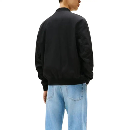 Tommy Hilfiger Jeans Blouson aviateur noir pour homme en coton biologique, avec poignets et taille côtelés et fermeture éclair