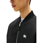 Blouson bomber noir Tommy Hilfiger en coton biologique avec fermeture éclair argentée et écusson drapeau emblématique sur la poitrine pour homme