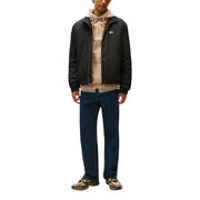 Tommy Hilfiger Blazer noir en polyester pour homme, zippé, avec petit logo brodé sur la poitrine gauche.