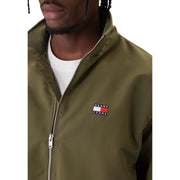 Blazer homme vert olive Tommy Hilfiger Jeans avec fermeture éclair argentée et logo brodé, veste longue en polyester à fermeture éclair.