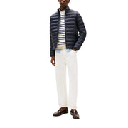 Veste zippée matelassée en nylon bleu marine pour homme par Tommy Hilfiger Jeans DM0DM20658 avec un design de type doudoune