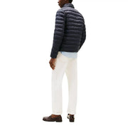 Veste zippée matelassée en nylon bleu marine pour homme par Tommy Hilfiger Jeans Modèle DM0DM20658 vu de face