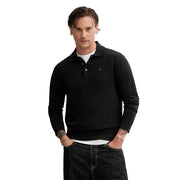 Polo slim noir Tommy Hilfiger pour homme, en coton biologique, avec poignets et ourlet côtelés.