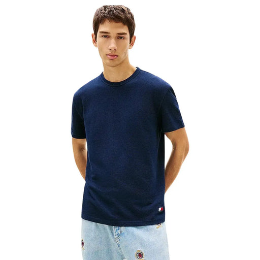 Navy blue textured cotton t-shirt with small tommy hilfiger logo on lower right side from tommy hilfiger jeans collection