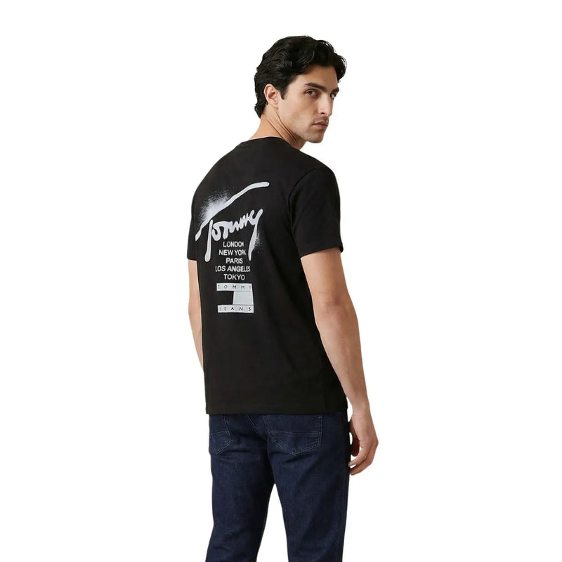 Black Tommy Hilfiger Jeans t-shirt with white graffiti logo and city names printed below on men’s casual wear