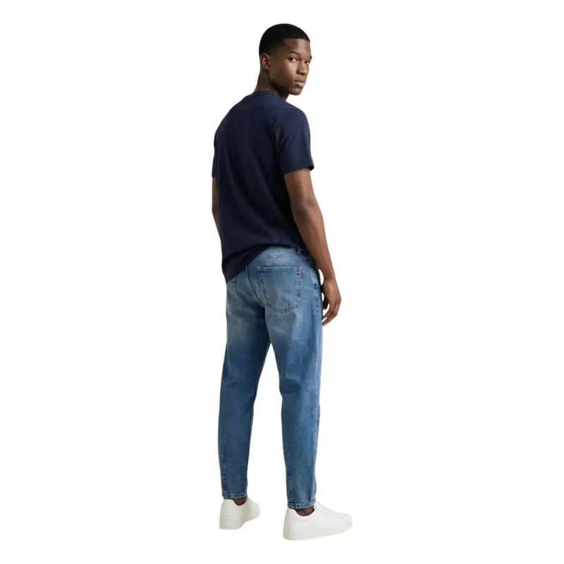 Tommy Hilfiger Jean en denim bleu moyen délavé, coupe classique cinq poches et délavage subtil pour homme